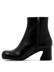 Ankle boots with shaped heel