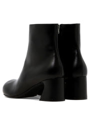 Ankle boots with shaped heel