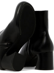 Ankle boots with shaped heel